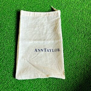 Preloved Ann Taylor dust bag 8 by 13. Beige with navy blue letters.